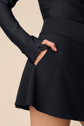 Black | Black Sophia a-line skort on a beige background