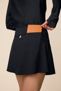 Black | Black Sophia a-line skort on a beige background