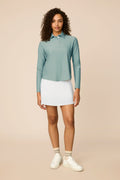 Meadow Haze | Woman wearing The Ella Long Sleeve Polo on a beige background