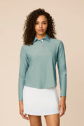Meadow Haze | Woman wearing The Ella Long Sleeve Polo on a beige background
