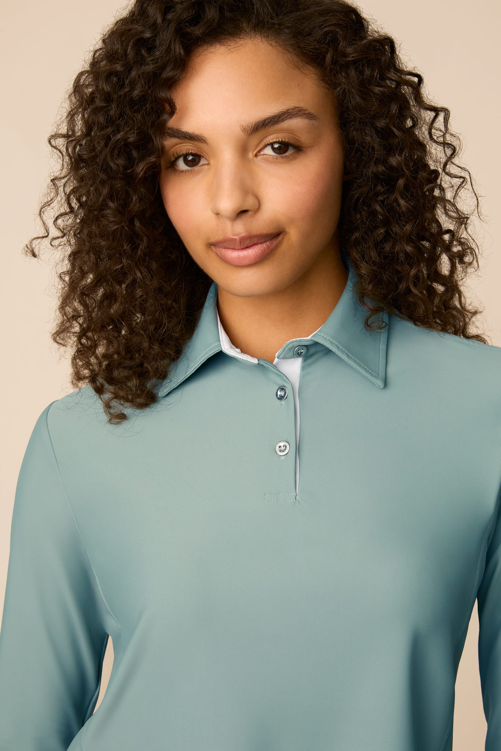 Meadow Haze | Woman wearing The Ella Long Sleeve Polo on a beige background