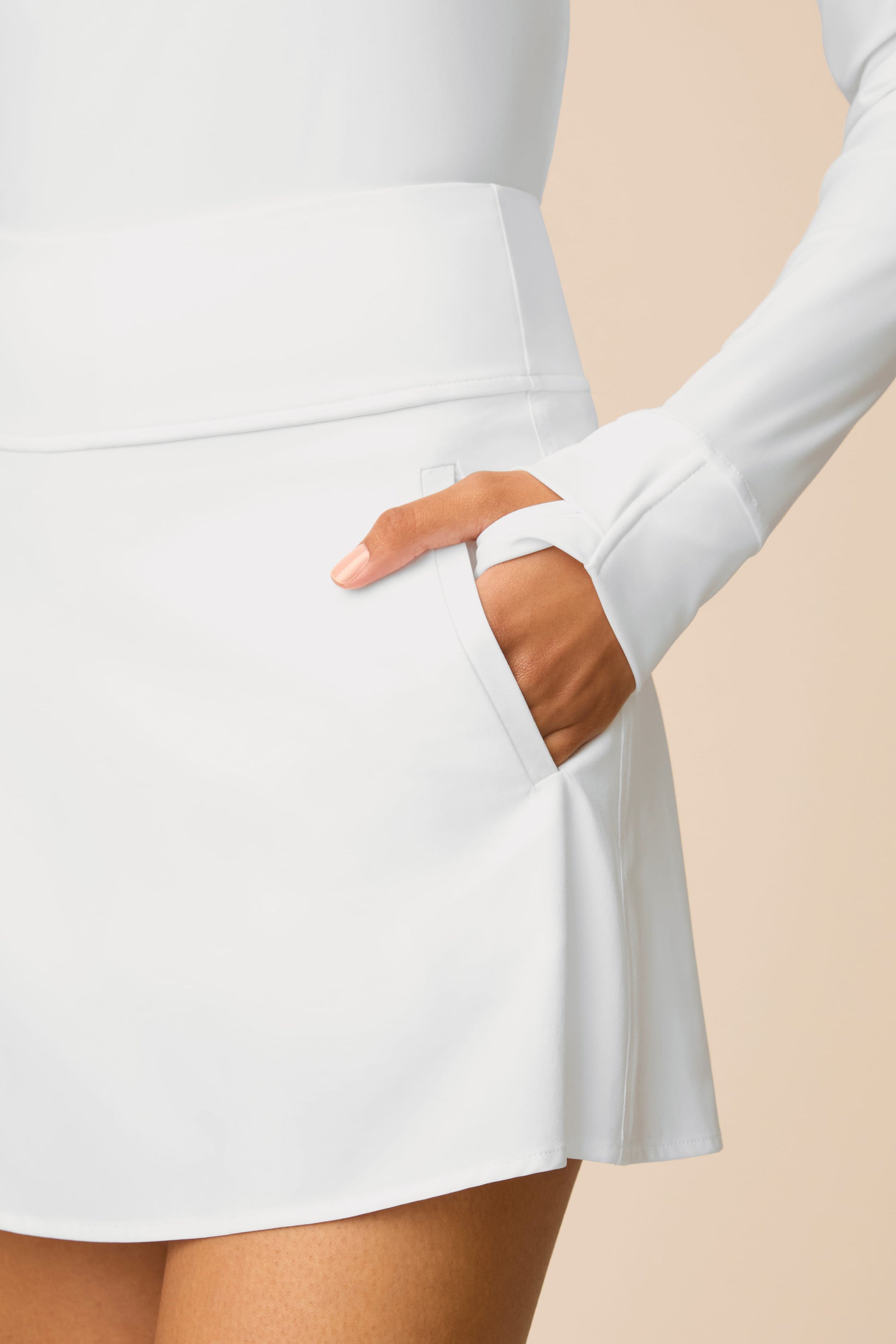 White | Model wearing a white Sophia a-line skort on a beige background