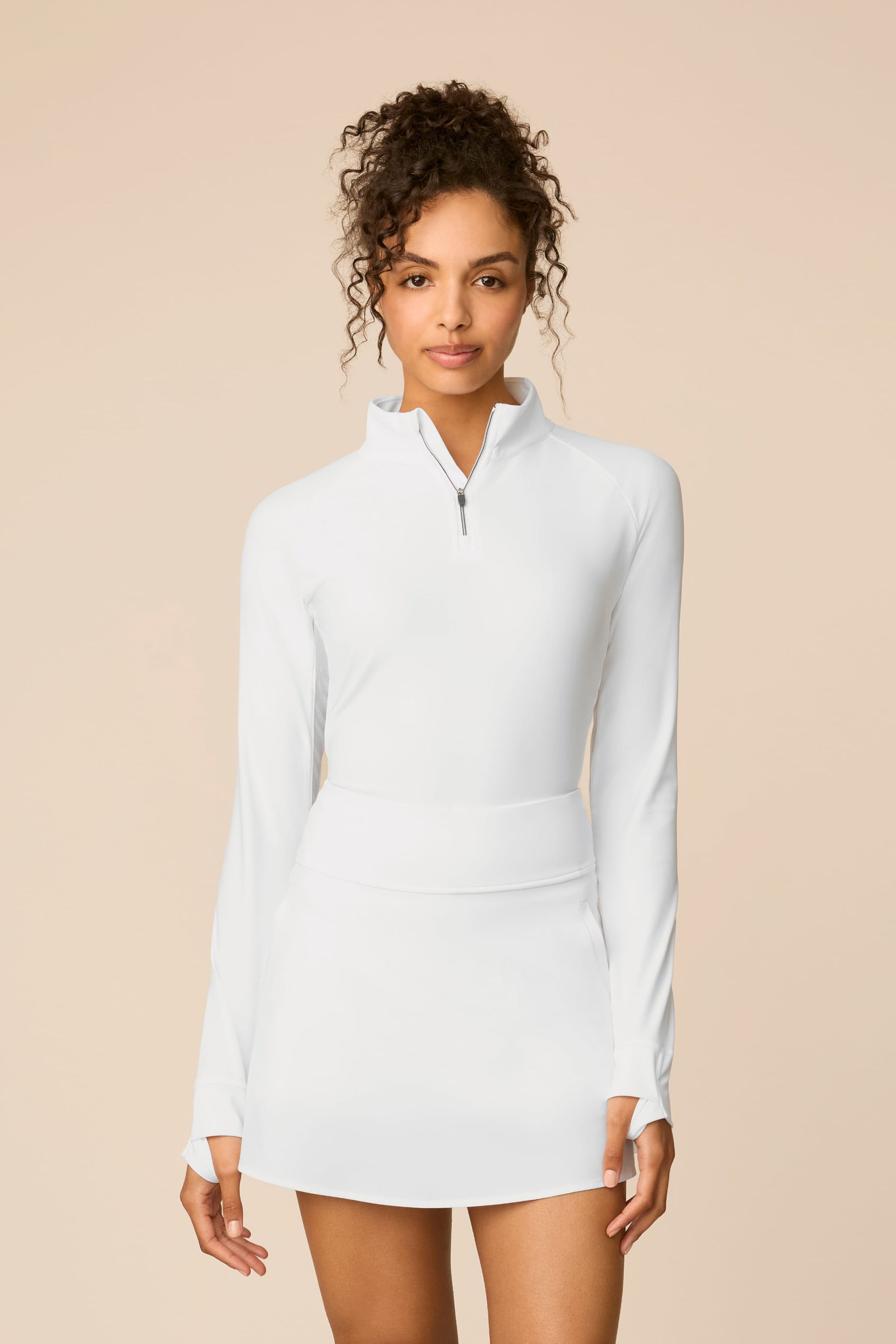 White | Model wearing a white Sophia a-line skort on a beige background