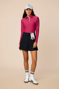 Aurora | Woman wearing The Ella Long Sleeve Polo on a beige background