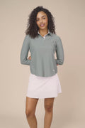 Meadow Haze | Woman wearing The Ella Long Sleeve Polo on a beige background