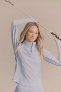 Skyline | Woman wearing quarter zip long sleeve
